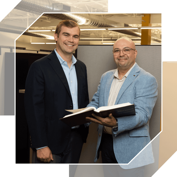 Professional engineers pose in suit jackets in TDIndustries headquarters office in Dallas