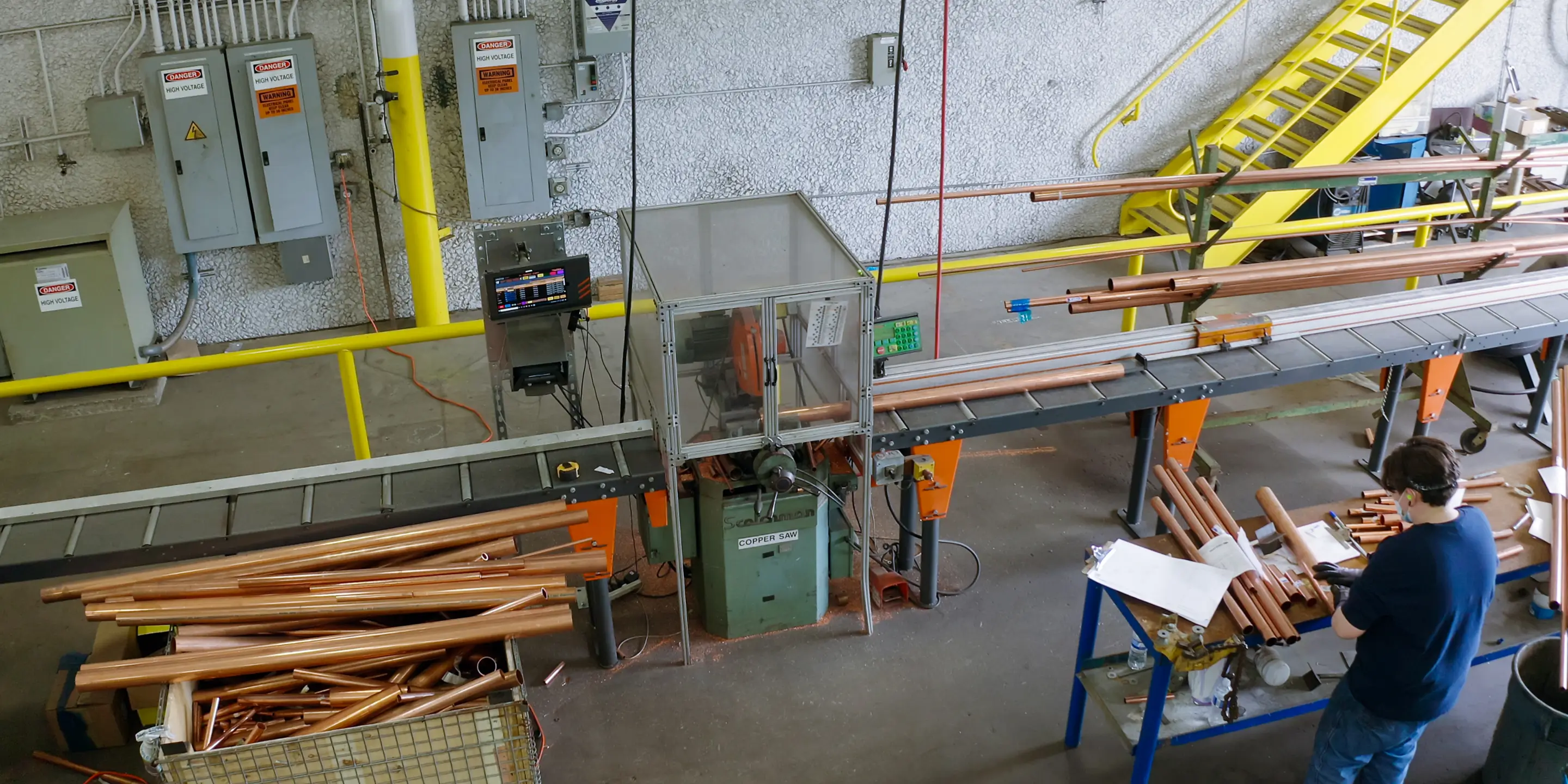 TigerStop equipment cuts and labels copper pipe at the TDIndustries manufacturing facility